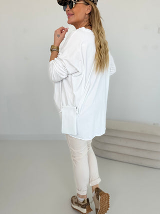 Langarmshirt in Weiss mit asymmetrischem Schnitt