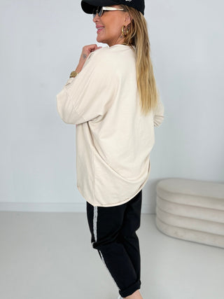 Langarmshirt in Beige mit Print mit rosanen Print auf der Brust